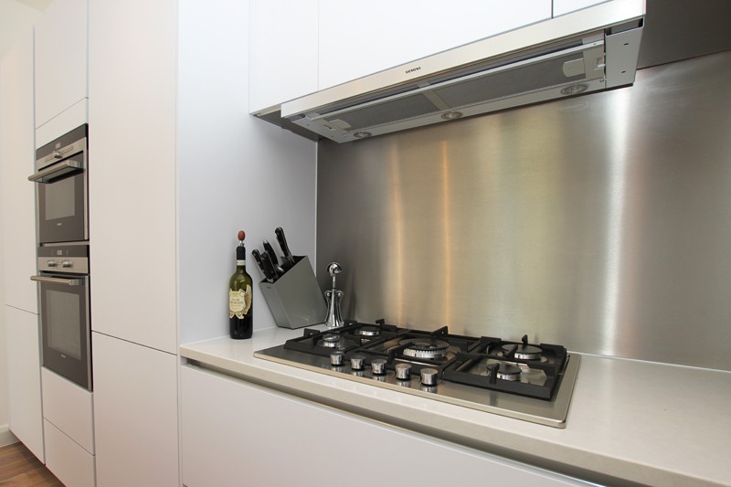 stainless steel kitchen splashback behind hob